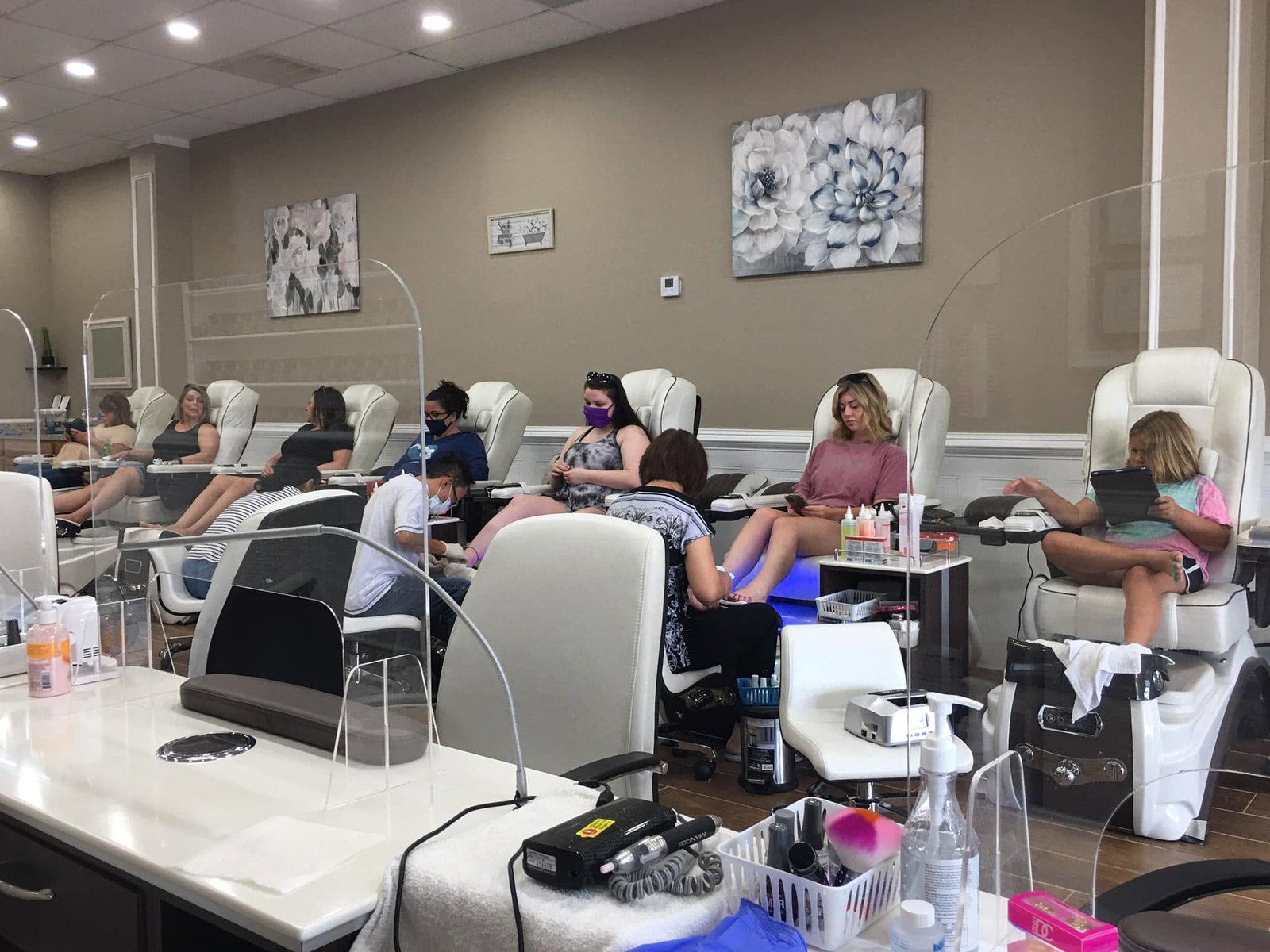 Guests relaxing in spa pedicure chairs at LaVie Nails Morganton NC