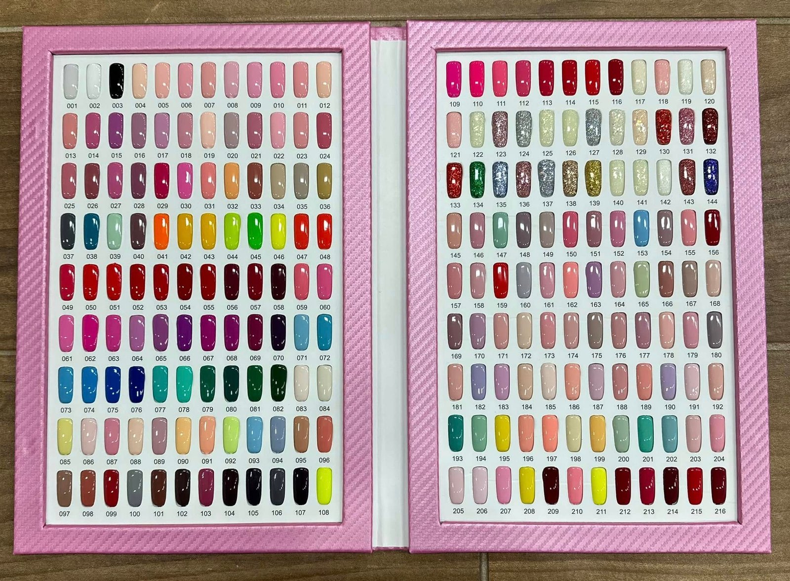 Color swatch books showing hundreds of gel and dip powder shades available at LaVie Nails