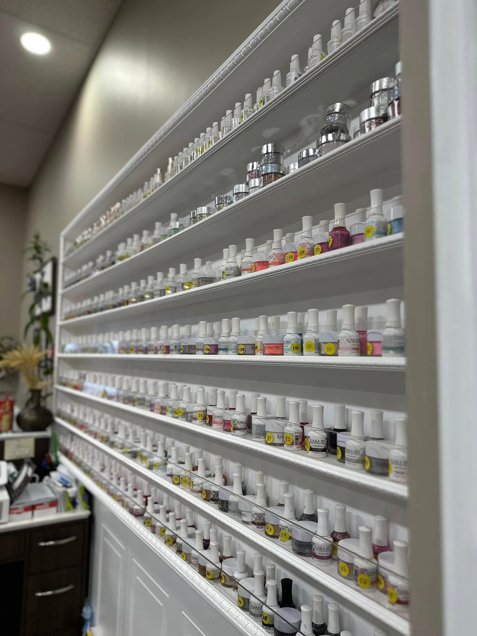 Floor-to-ceiling shelves of gel polish at LaVie Nails Morganton