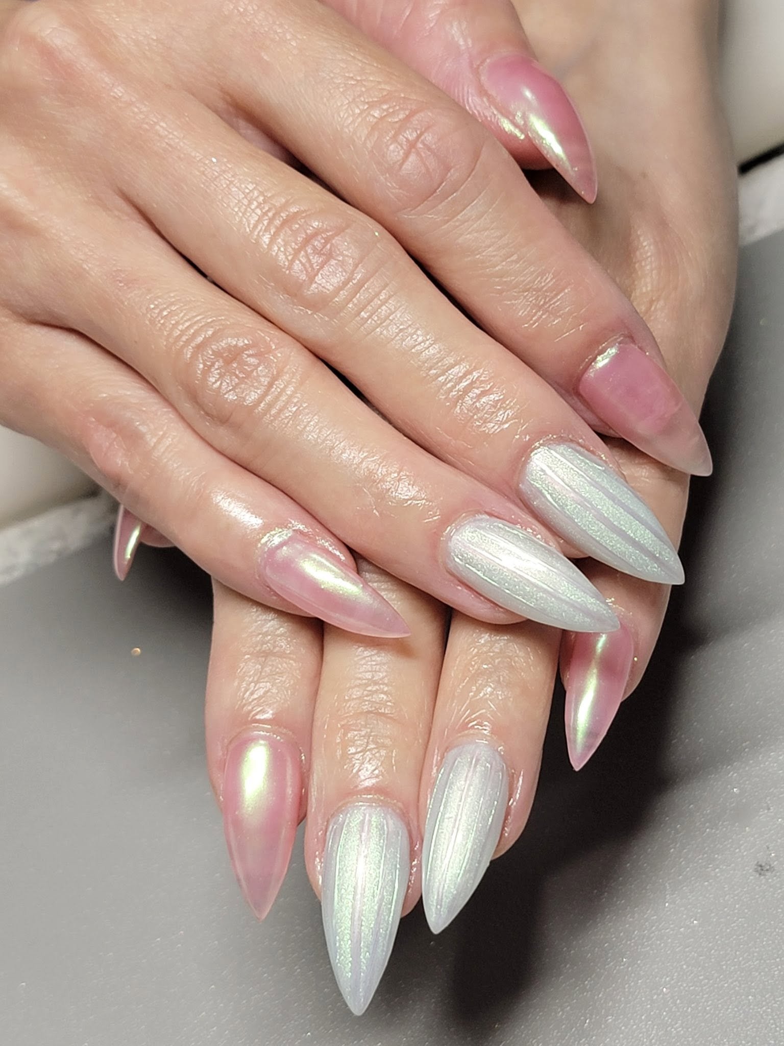 Soft pink and iridescent chrome almond-shaped manicure by LaVie Nails